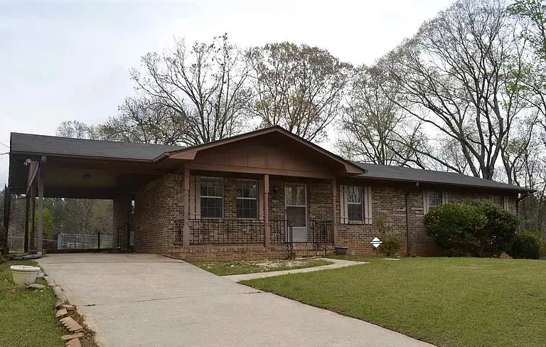 Brick single-family home in Alabama funded with a $150,000 cash-out refinance arranged by Barts Bucks